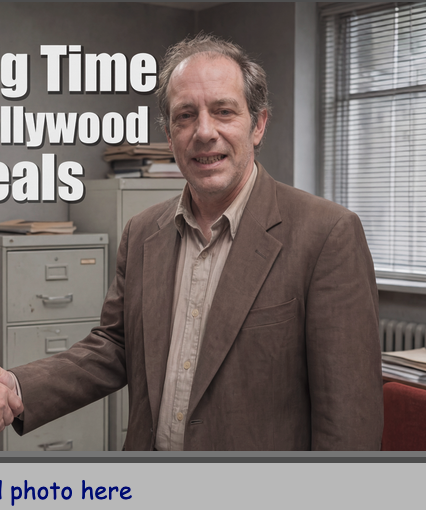 Martin Hales — brown suit, in the office